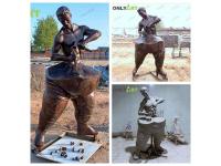 Self Made Man Statue Behind Meaning