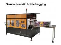 The difference with semi-automatic and full-automatic bottle bagging machine