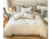 What are some common types of stains that may require professional cleaning for bedding?
