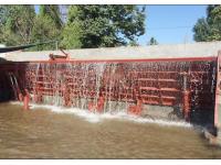How do water gate barriers prevent flooding?