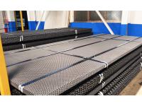 Self-Cleaning Open Grid Design to Eliminate Slurry Blinding